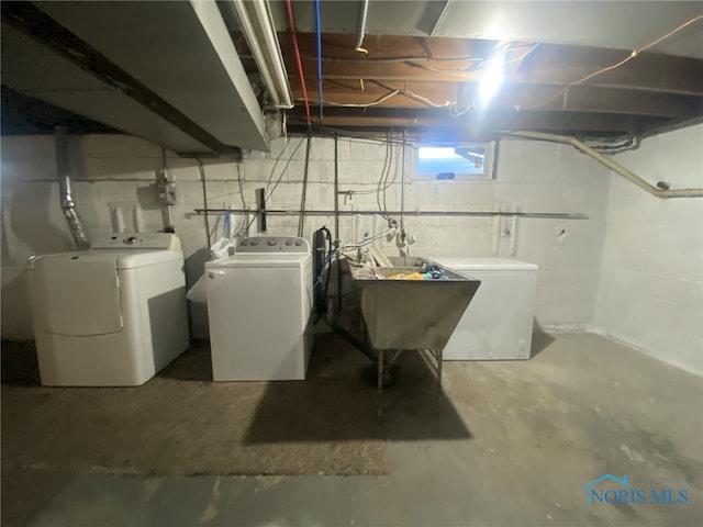 laundry area featuring washer and dryer and sink