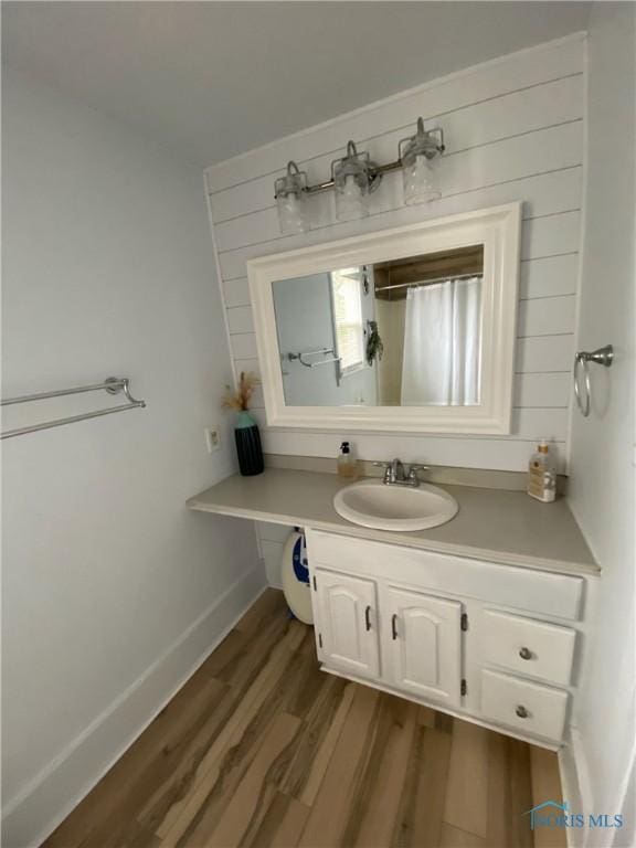 bathroom featuring vanity and wood-type flooring