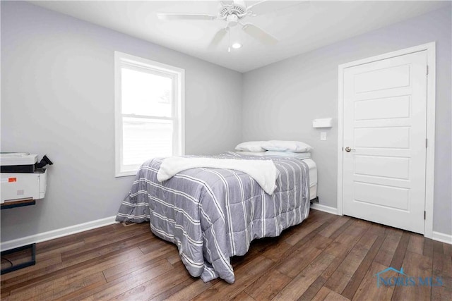 bedroom featuring hardwood / wood-style flooring, baseboards, and ceiling fan