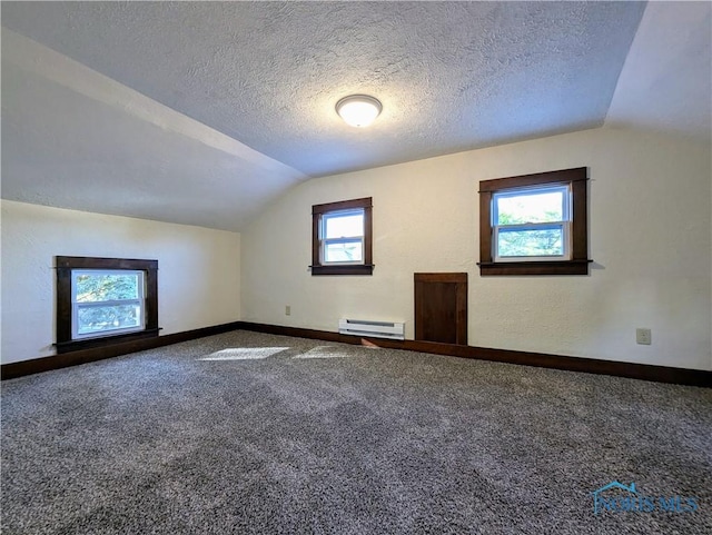 bonus room with carpet flooring, a textured ceiling, a baseboard radiator, and vaulted ceiling