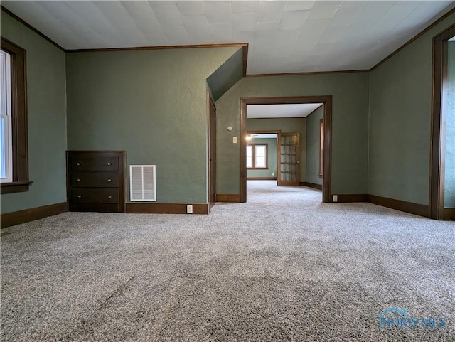 unfurnished room featuring carpet and ornamental molding