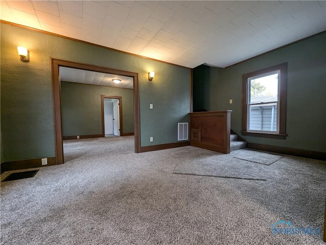 unfurnished room featuring carpet flooring