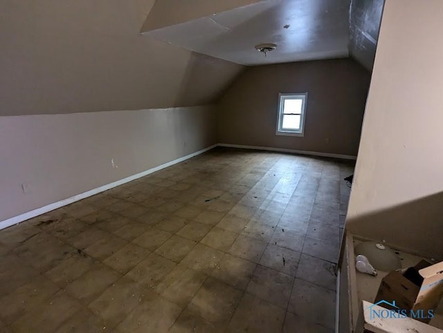 bonus room featuring lofted ceiling