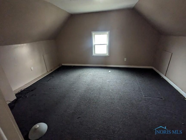 bonus room featuring carpet and lofted ceiling