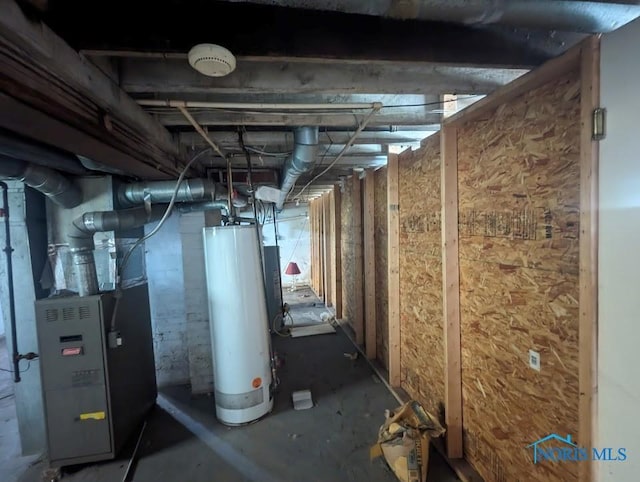 basement featuring heating unit and water heater