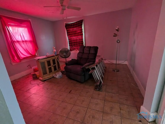 sitting room with ceiling fan