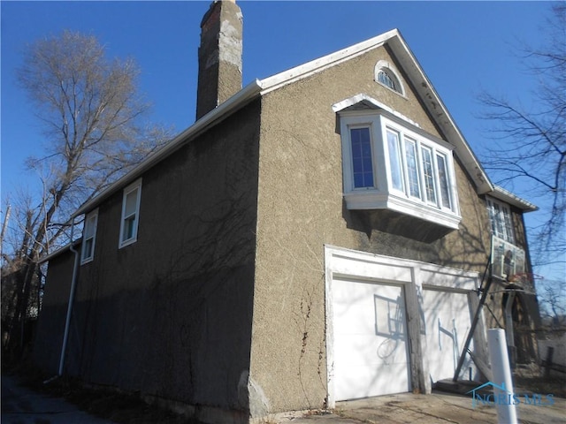 view of property exterior with a garage