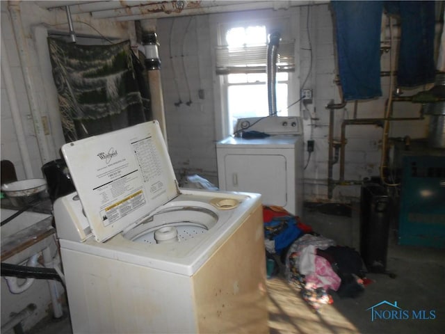 laundry area with separate washer and dryer