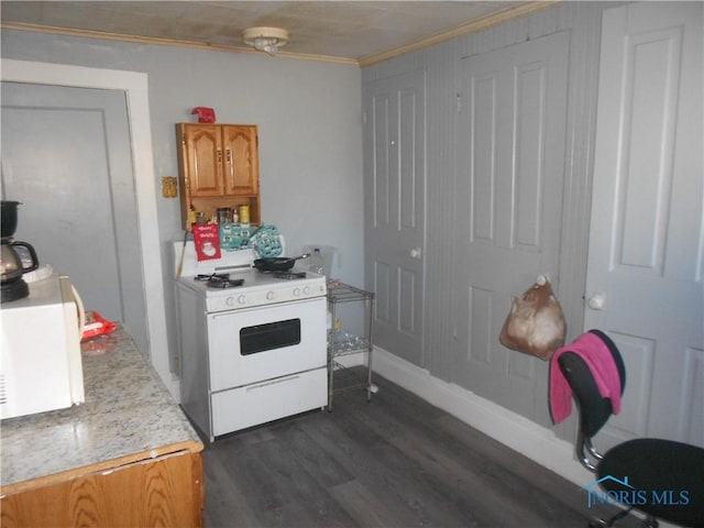 kitchen with gas range gas stove, dark hardwood / wood-style flooring, and ornamental molding