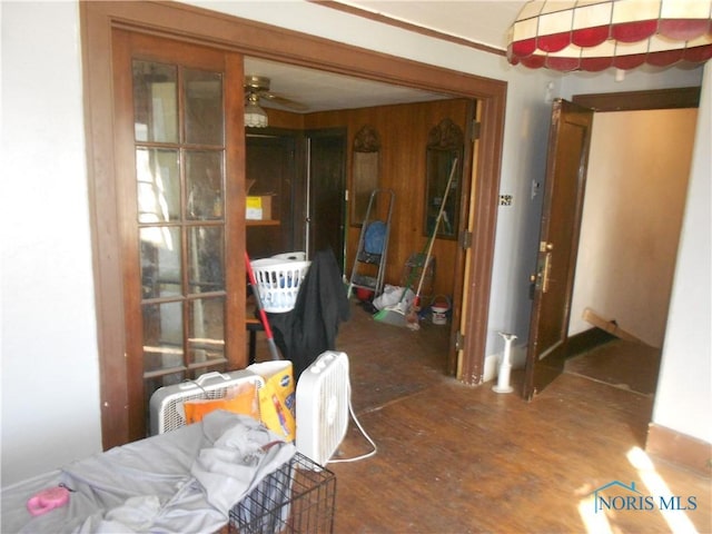 interior space with ceiling fan and dark hardwood / wood-style floors