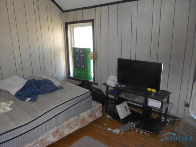 bedroom with hardwood / wood-style flooring