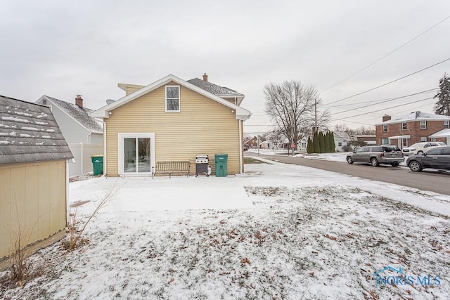 view of snow covered property