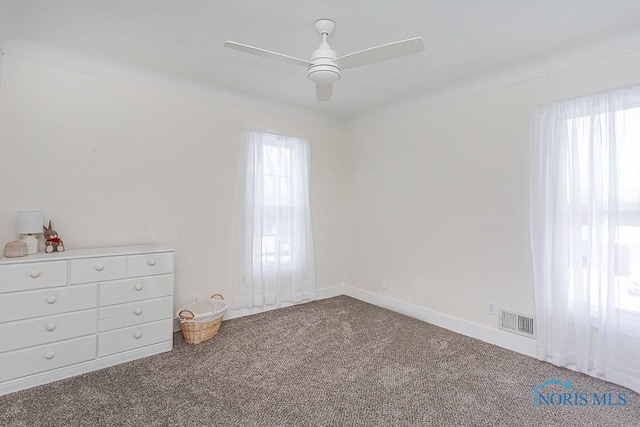 unfurnished bedroom featuring ceiling fan and carpet floors