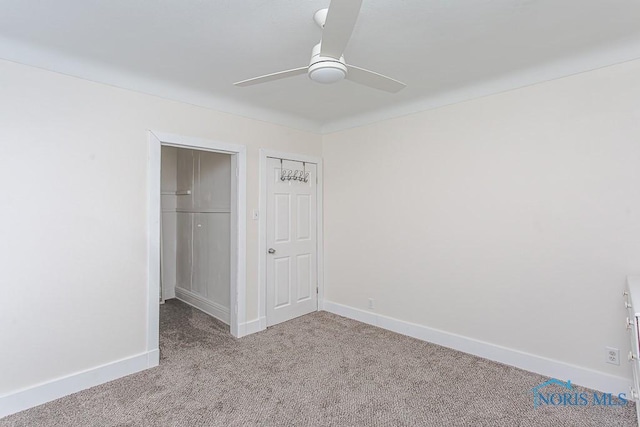 unfurnished bedroom featuring ceiling fan and light carpet