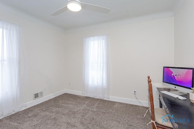 office space with ceiling fan and carpet