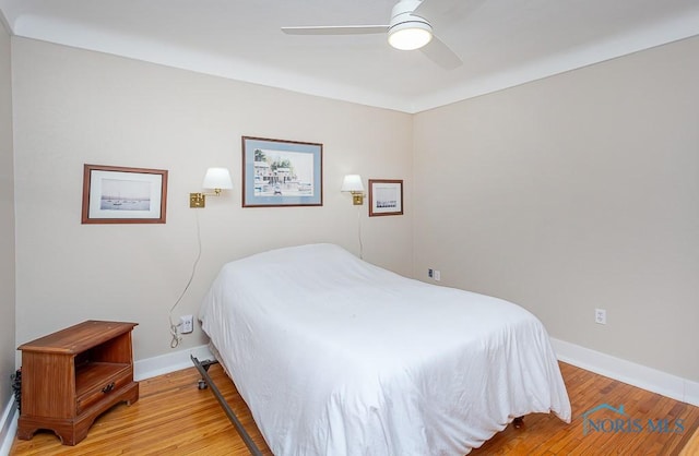 bedroom featuring ceiling fan and hardwood / wood-style floors