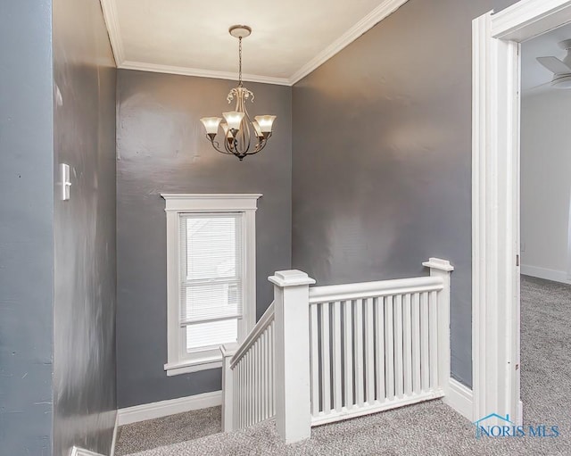 stairway featuring carpet floors, a notable chandelier, and ornamental molding