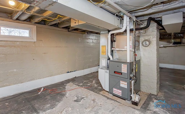 utility room featuring heating unit