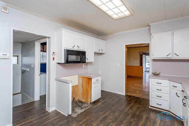 kitchen featuring white cabinetry, dark wood-type flooring, and ornamental molding