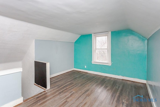 bonus room featuring hardwood / wood-style flooring and lofted ceiling