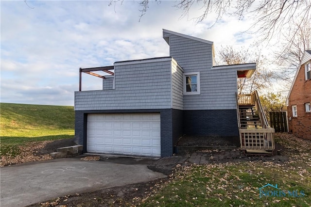 view of side of home featuring a garage