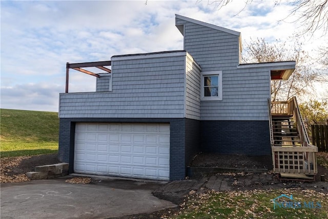 view of side of property featuring a garage