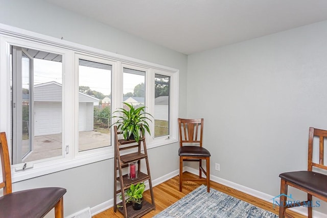 sitting room with hardwood / wood-style flooring