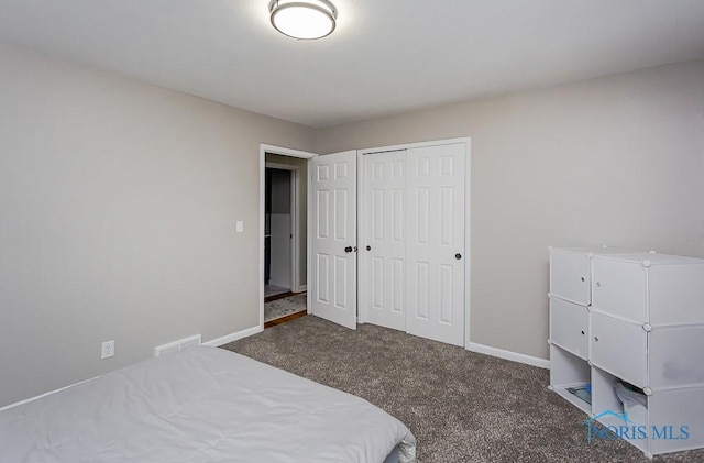 carpeted bedroom with a closet