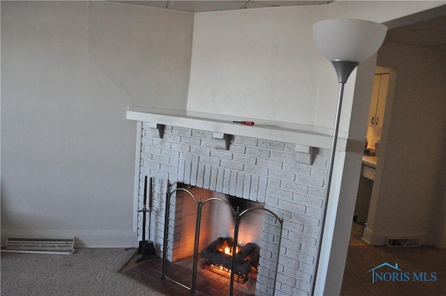 details featuring carpet and a brick fireplace