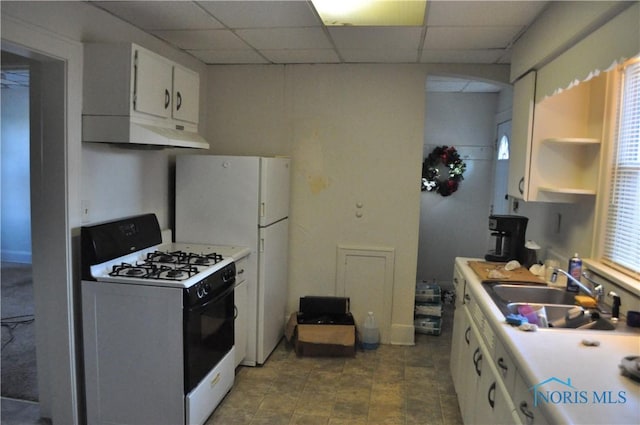 kitchen featuring white range with gas cooktop, white cabinetry, sink, and a drop ceiling