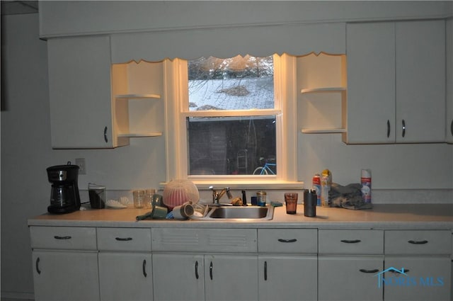 kitchen with sink and white cabinets