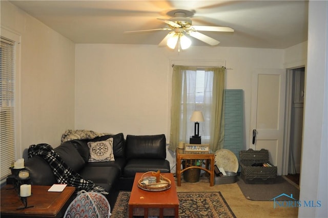 living room with carpet flooring and ceiling fan