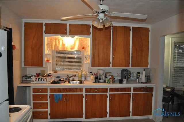 kitchen with ceiling fan and sink