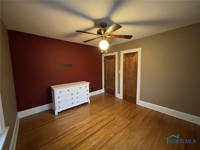 unfurnished bedroom with light hardwood / wood-style floors and ceiling fan