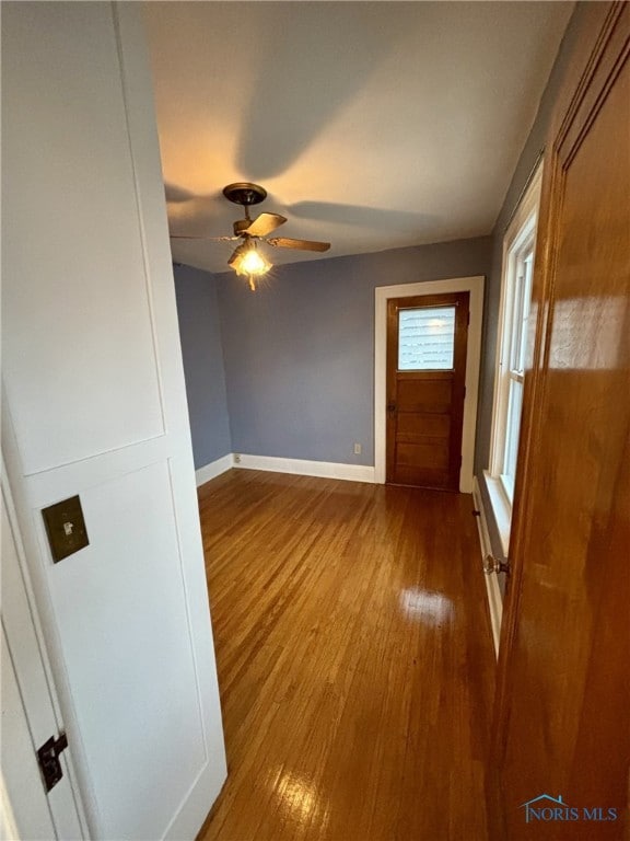 interior space with ceiling fan and light hardwood / wood-style flooring