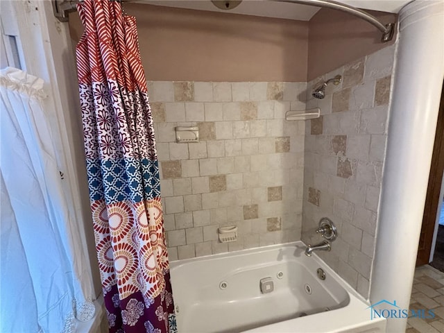 bathroom with shower / bath combo with shower curtain