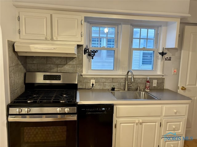 kitchen with ventilation hood, white cabinetry, and stainless steel range with gas stovetop