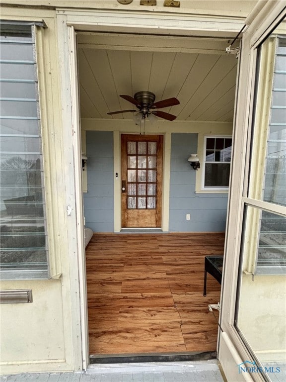 entrance to property with ceiling fan