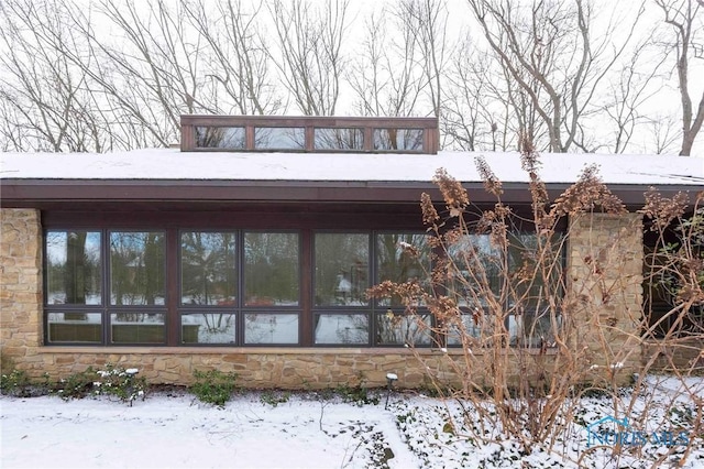 view of snow covered property