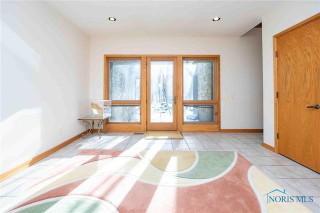 doorway featuring light tile patterned floors