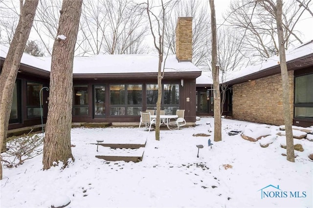 view of snow covered house