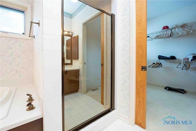 bathroom with a shower with door