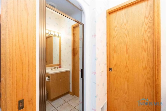 bathroom featuring tile patterned floors and vanity