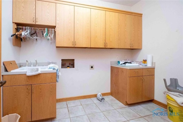 laundry area featuring washer hookup, electric dryer hookup, cabinets, and sink