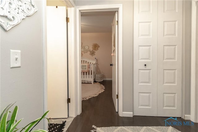 hallway featuring dark hardwood / wood-style flooring