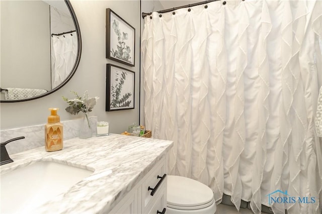 bathroom with vanity and toilet