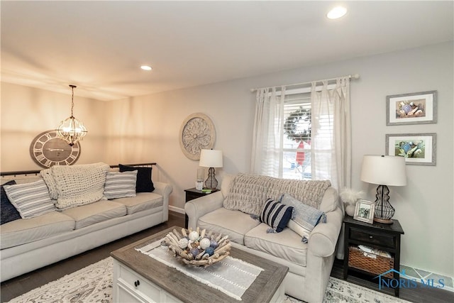 living room with an inviting chandelier