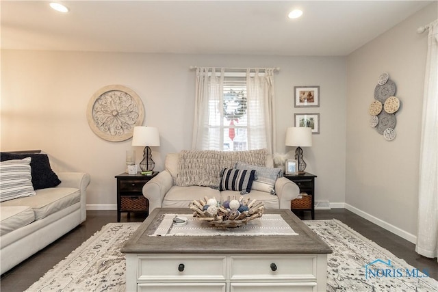 living room with dark hardwood / wood-style floors