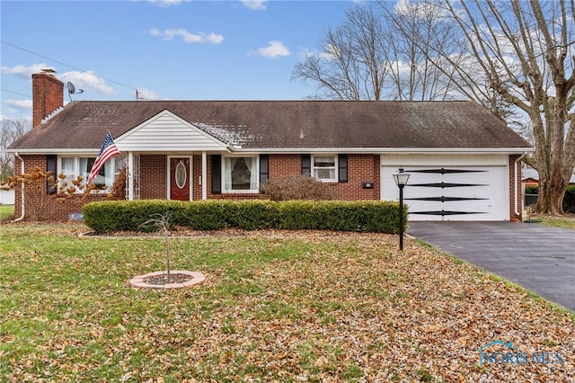 ranch-style house with a garage and a front yard