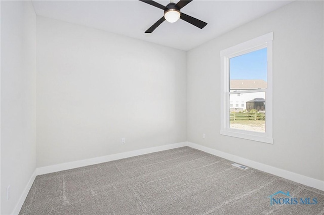 carpeted empty room with ceiling fan